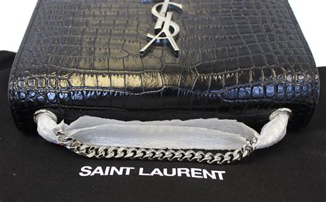 ysl cluthces|YSL crocodile clutch.